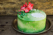 green cake with sugar flowers