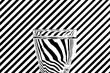 Abstract refraction of black and white diagonals in a glass of w