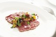 © neillangan - beef carpaccio plated appetizer starter