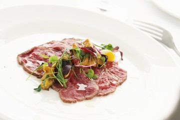 Canvas Print - beef carpaccio plated appetizer starter