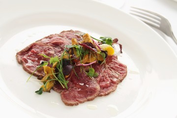 Sticker - beef carpaccio plated appetizer starter