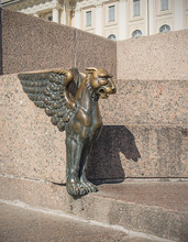 Bronze Winged Lion On The University (Universitetskaya) Embankment Of The Neva River In St. Petersburg, Russia.
