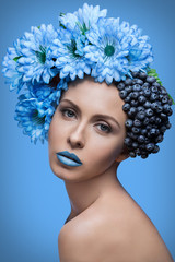 Girl with blueberries and flowers