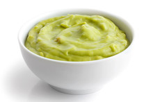Round White Bowl Of Tortilla Guacamole Dip Isolated In Perspecti