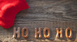 Schriftzug Ho Ho Ho / Weihnachten auf altem Treibholz / Holz Brett mit Weihnachtsstiefel
