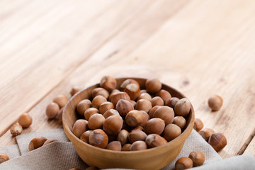 Wall Mural - Hazelnuts on wooden table