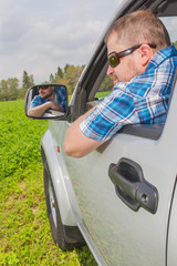 Wall Mural - Man sitting in a car