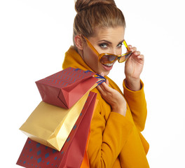 Poster - Woman wearing autumn overcoat holding shopping bag.