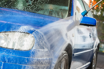 Blue car in a car wash