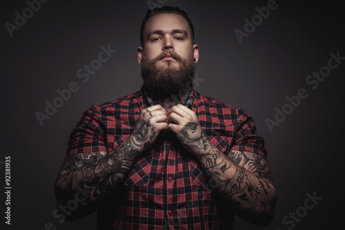 Photo  Brutal man with beard and tattoes