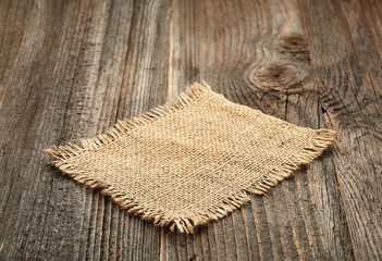 Wall Mural - burlap napkin on wooden table