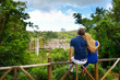 Young couple enjoying a view on Chamarel falls of Mauritius