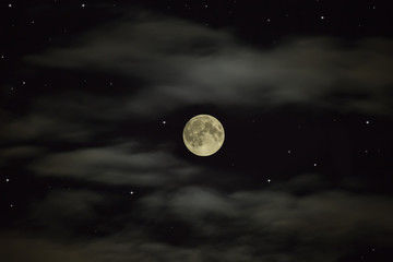 Wall Mural - Night sky. Full moon on the starry sky with clouds