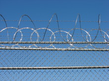 Razor Wire Barbed Fence And Blue Sky