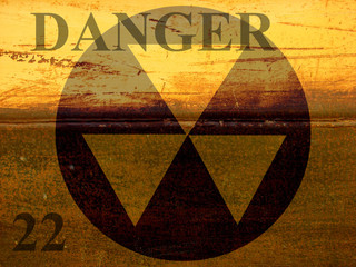 grunge industrial background design with danger warning and radiation symbol