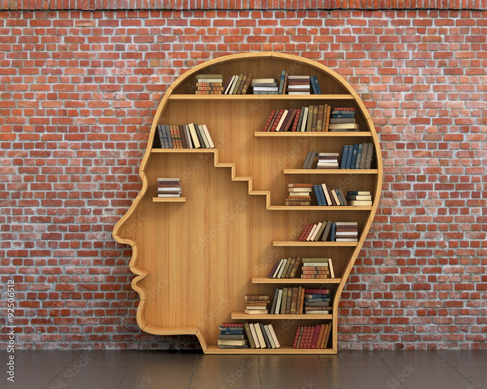 Concept of training. Wooden bookshelf full of books in form of m - obrazy, fototapety, plakaty 