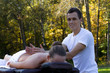 © PaulShlykov - Man giving massage to young brunette outdoors