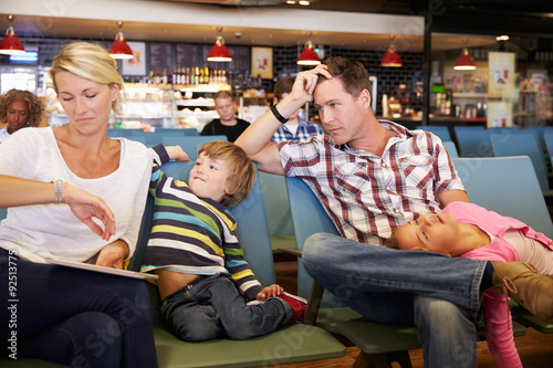 Fotografie, Obraz Family In Airport Departure Lounge Wait For Delayed Flight
