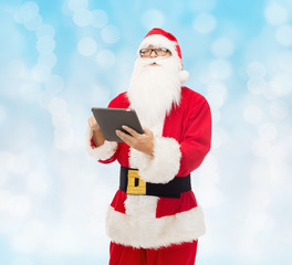 Canvas Print - man in costume of santa claus with tablet pc