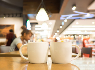 Aufkleber - Coffee cup on wood table in cafe with blur background, Leisure l