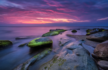 Wall Mural - sea rocks at sunrise. magnificent sunrise view in the blue hour at the black sea coast, bulgaria