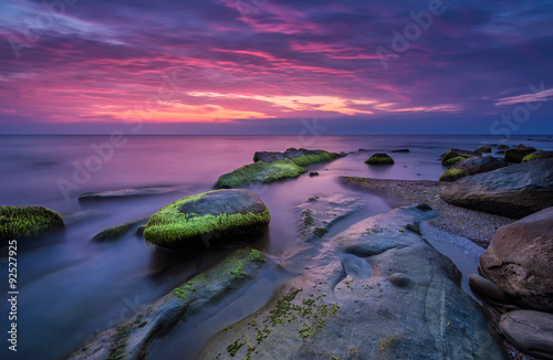 Sea rocks at sunrise. Magnificent sunrise view in the blue hour at the Black sea coast, Bulgaria 