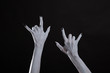 © Elisanth - Pale monster hands showing heavy metal symbol