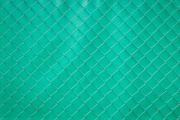  Steel mesh rusty on green background.