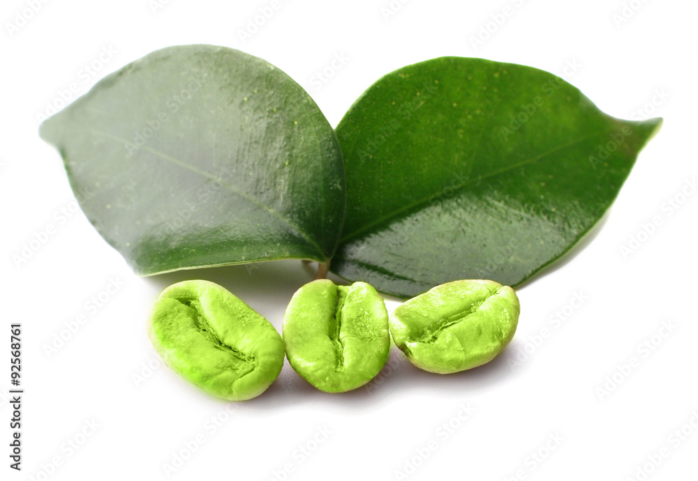 Green coffee beans with leaves isolated on white
