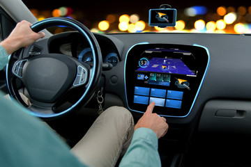 Canvas Print - close up of man driving car with navigation system