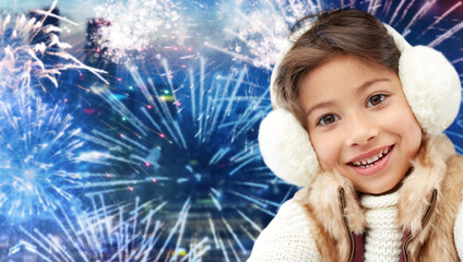 Sticker - happy little girl wearing earmuffs over firework