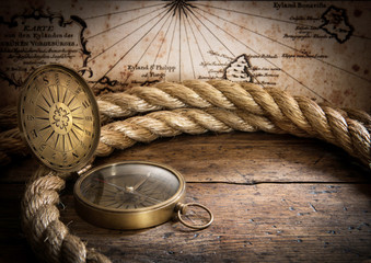 Fototapete - old compass and rope on vintage map