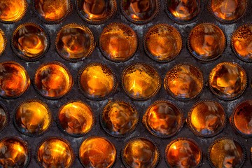 The wall of glass bottles bottoms folded forward. Background. Se