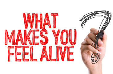 Hand with marker writing: What Makes You Feel Alive?