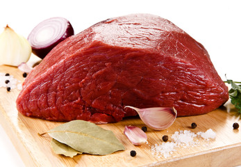 Sticker - Fresh raw beef on cutting board on white background 