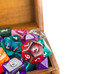Close up of wooden chest full of dice