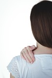 Fototapeta  - Woman touching her sore shoulder