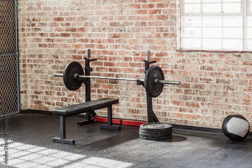 Fototapeta do kuchni A barbell next to weights