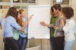 © WavebreakMediaMicro - Business people looking at whiteboard