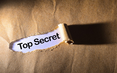 torn paper with word Top Secret