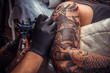 © Mr. Prof - Master working tattooing in tattoo studio