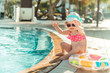 © tan4ikk - little  girl sitting near the pool