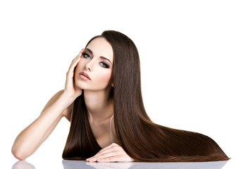 Wall Mural - Portrait of beautiful young woman with long straight brown hair