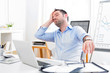 © Production Perig - Young attractive man too tired to work