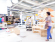 © themorningglory - Blurred image of people shopping at mall of home decor