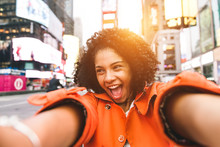 Afro American Woman Taking Selfie In Time Square, New York