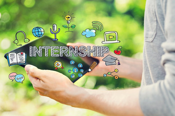 Poster - Internship concept with young man holding his tablet computer