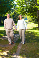 Sticker - Happy senior couple in park.