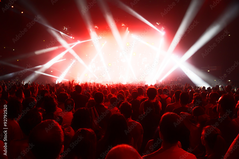 concert crowd of young people in front of bright stage lights - obrazy, fototapety, plakaty 