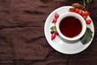 Autumn cup of tea with different berries